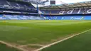 Stamford Bridge from a corner of the pitch, with blue stands on two sides