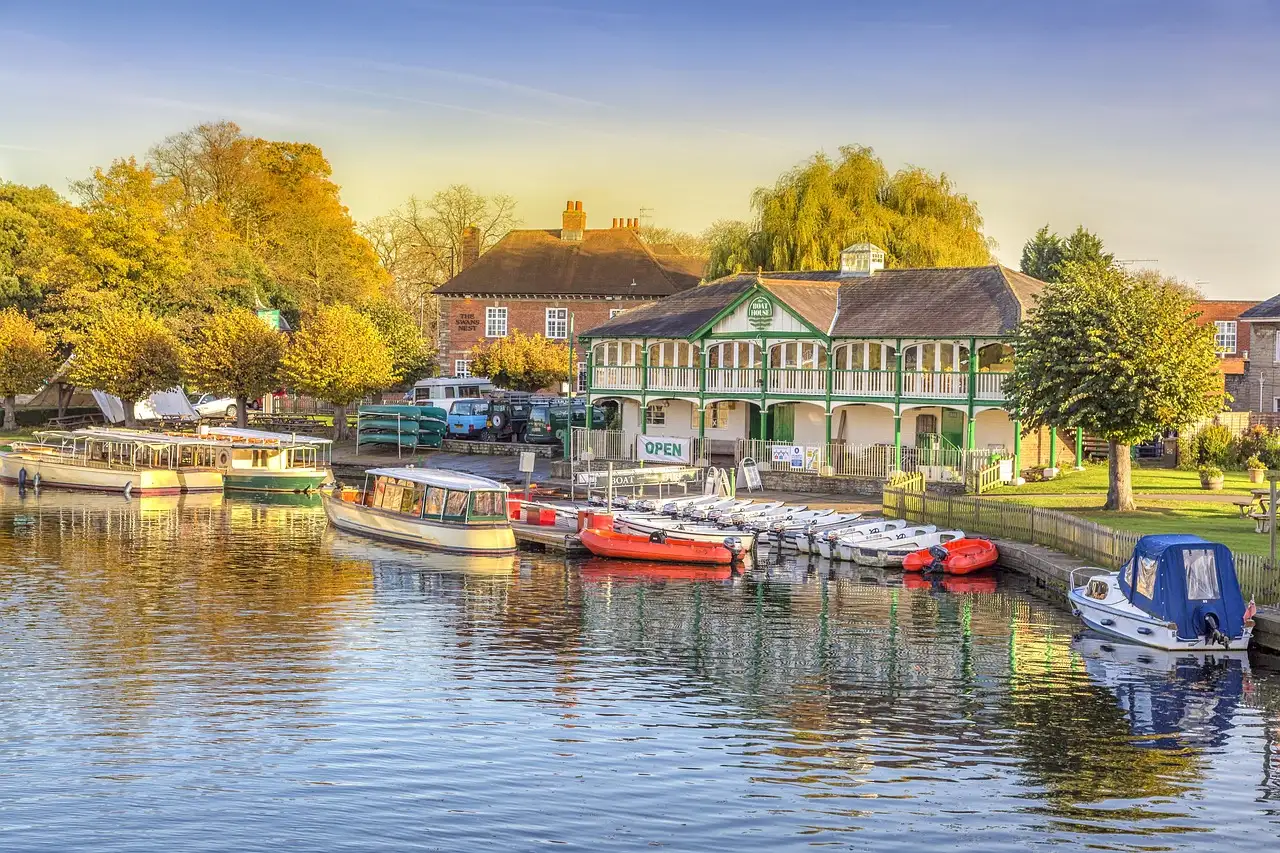 Boats moored on the River Avon at Stratford-upon-Avon in warm evening light