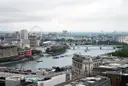 View over the River Thames and its bridges from above, the London Eye in the distance