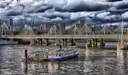 River boats moored on the Thames beside Hungerford Bridge