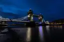 Tower Bridge lit up at night over the River Thames