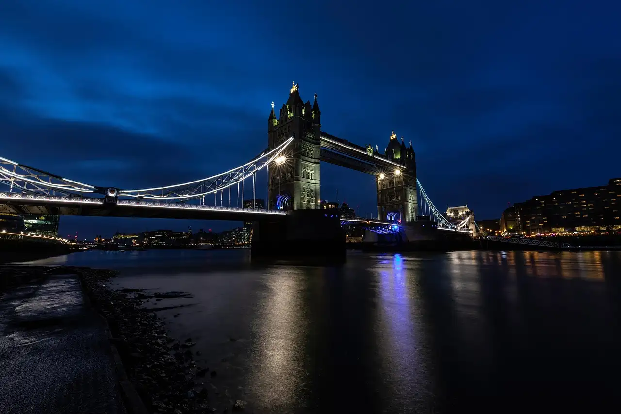 Tower Bridge lit up at night over the River Thames