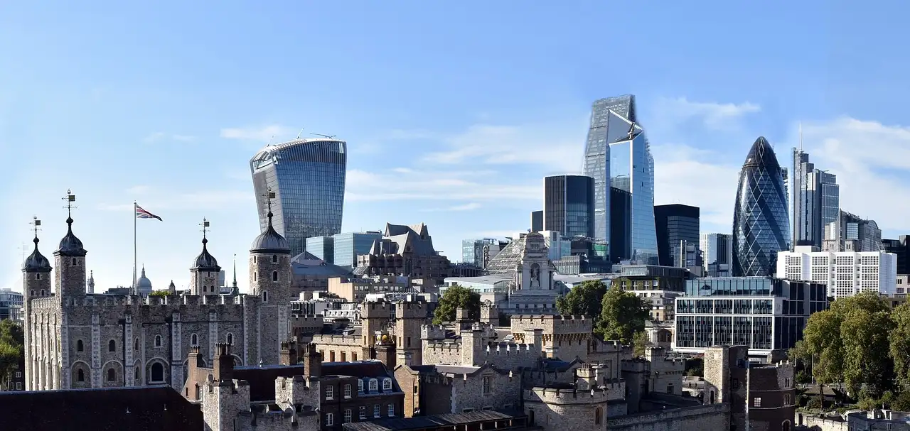 The Tower of London with the City of London's glass towers behind it