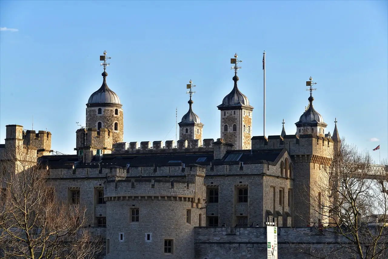 Turrets of the Tower of London against a clear blue sky