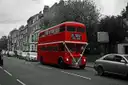 A vintage red Routemaster bus on a London street