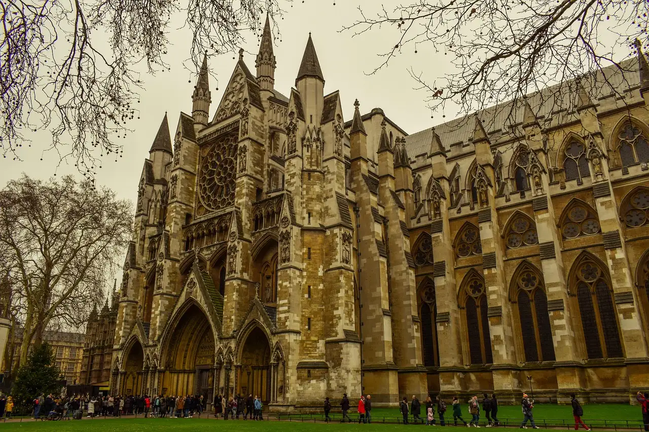 Westminster Abbey's Gothic north side and rose window above the lawn